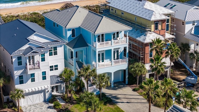 bird's eye view featuring a view of the beach and a water view