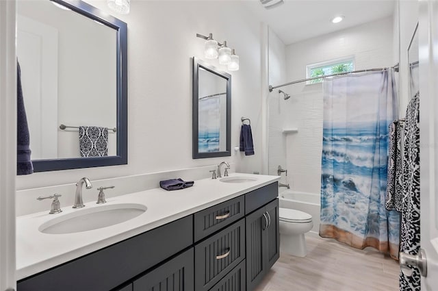 full bathroom featuring shower / tub combo, vanity, and toilet