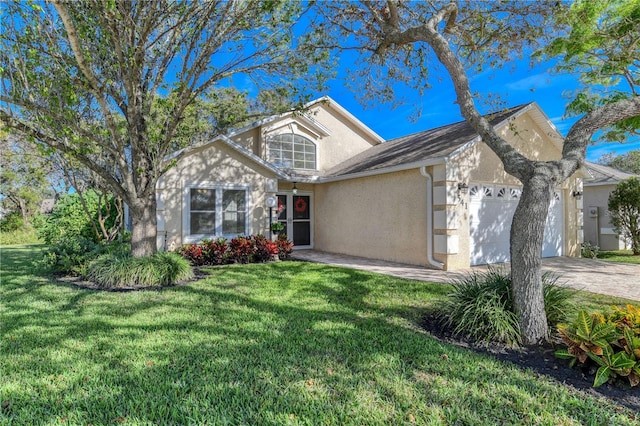 front of property featuring a garage and a front lawn