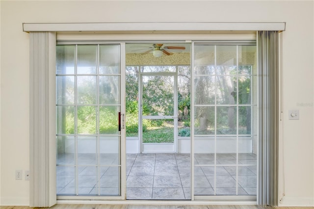 entryway featuring wood-type flooring and ceiling fan