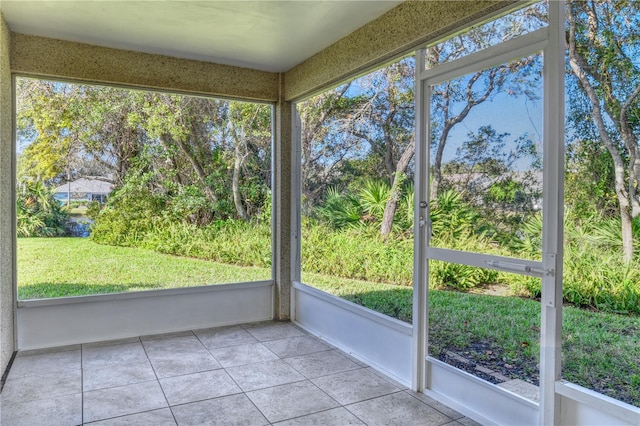 unfurnished sunroom featuring a healthy amount of sunlight