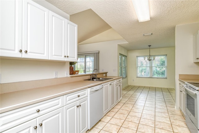 kitchen featuring dishwasher, decorative light fixtures, white cabinets, and sink