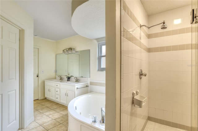 bathroom with vanity, a textured ceiling, tile patterned floors, and separate shower and tub