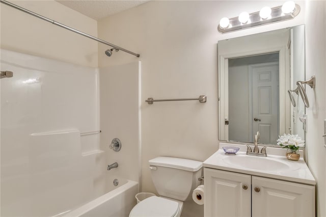 full bathroom featuring vanity, a textured ceiling, toilet, and  shower combination