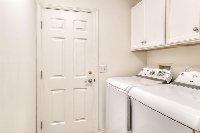 laundry area featuring cabinets and independent washer and dryer