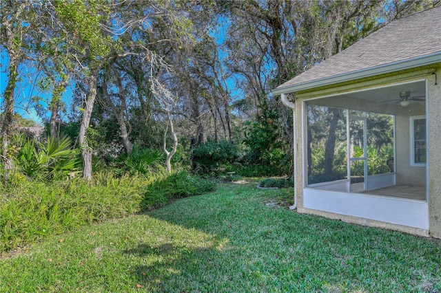 view of yard with a sunroom