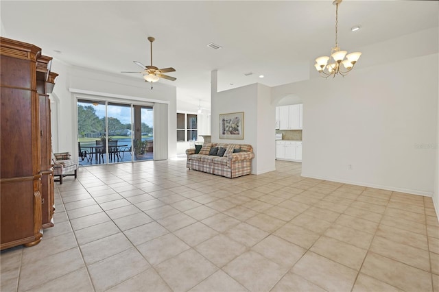 tiled living room with ceiling fan with notable chandelier