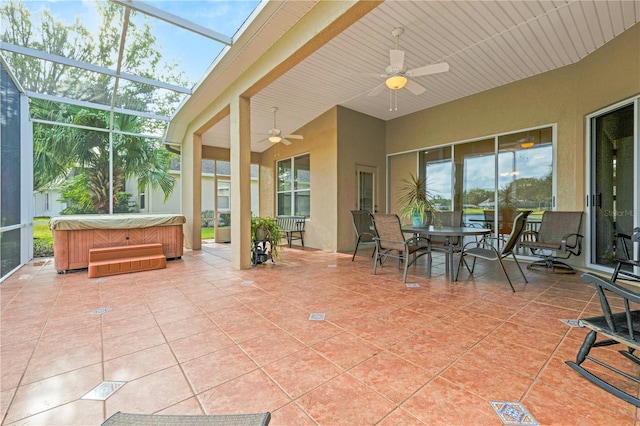 sunroom with a skylight and ceiling fan