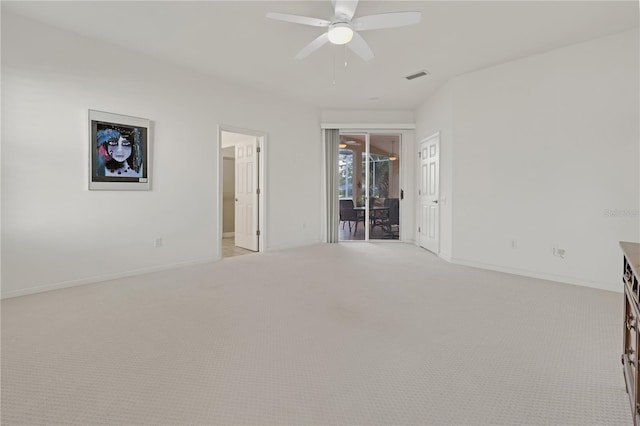 carpeted spare room featuring ceiling fan