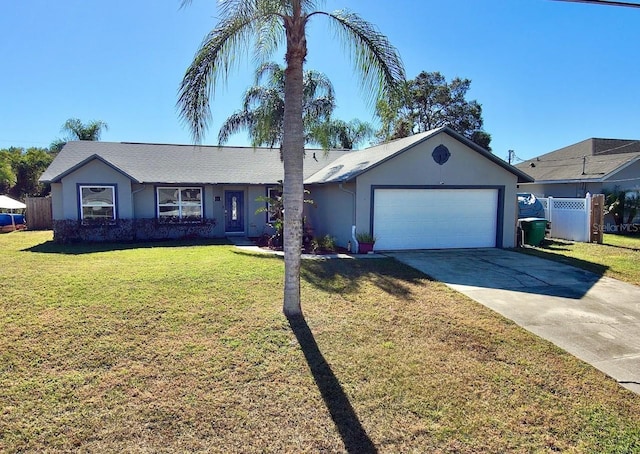 ranch-style home featuring a garage and a front yard