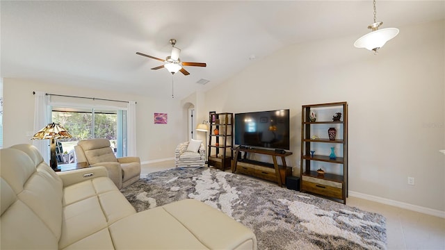 living room featuring ceiling fan and lofted ceiling