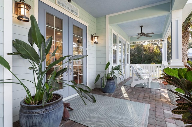 view of patio featuring covered porch, french doors, and a ceiling fan