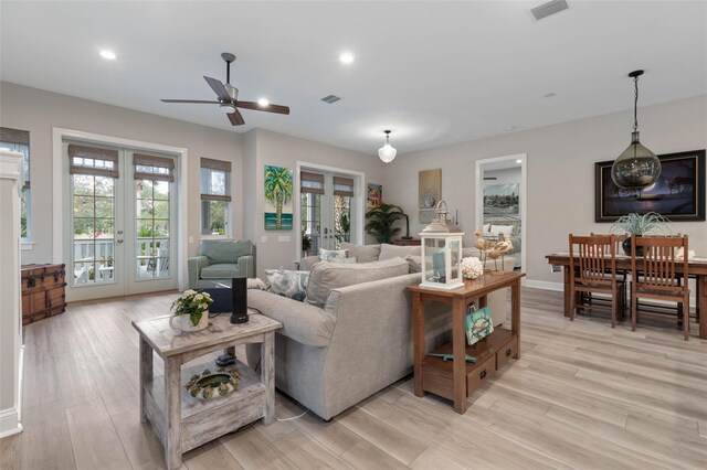 35 Smiling Fish Ln, Palm Coast, FL 32137 - living room with french doors, a ceiling fan, healthy amount of natural light, light wood-style flooring, and recessed lighting