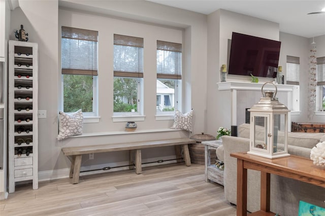 sitting room featuring baseboards and wood finished floors