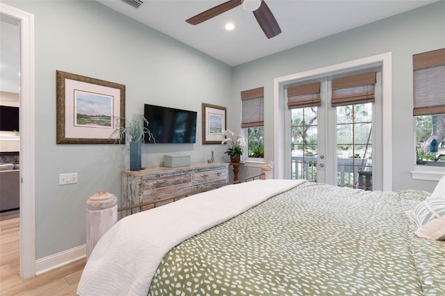 bedroom with access to exterior, french doors, recessed lighting, wood finished floors, and baseboards