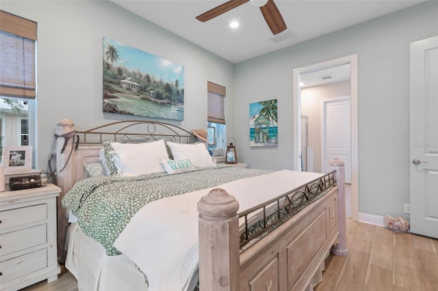 bedroom with recessed lighting, a ceiling fan, visible vents, baseboards, and light wood-type flooring