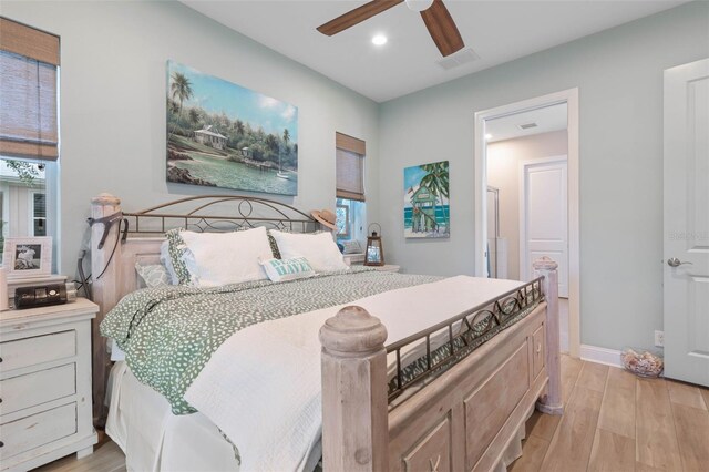 35 Smiling Fish Ln, Palm Coast, FL 32137 - bedroom featuring light wood-style flooring, recessed lighting, multiple windows, a ceiling fan, and baseboards