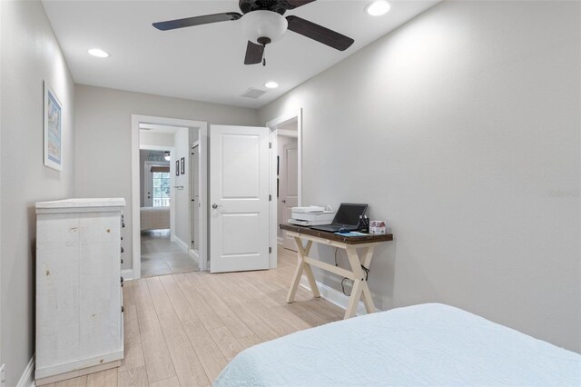 bedroom featuring baseboards, light wood finished floors, visible vents, and recessed lighting