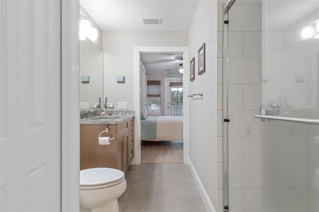 full bathroom featuring toilet, visible vents, vanity, a ceiling fan, and a shower stall