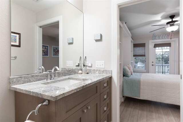 35 Smiling Fish Ln, Palm Coast, FL 32137 - bathroom with wood finished floors, a ceiling fan, and vanity