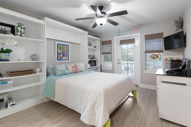 bedroom featuring a ceiling fan, light wood-type flooring, access to outside, and baseboards