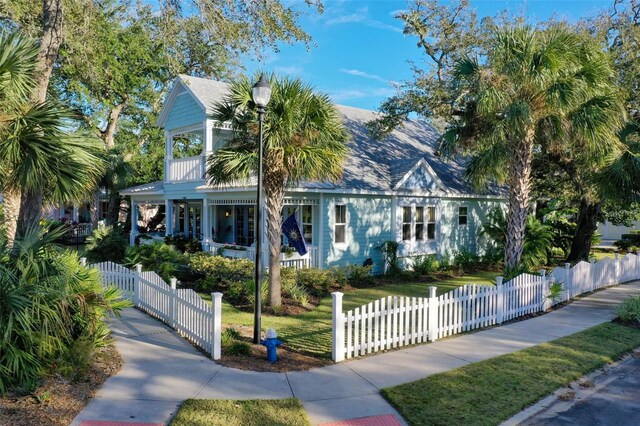 35 Smiling Fish Ln, Palm Coast, FL 32137 - view of front of property with a porch, a fenced front yard, and a gate