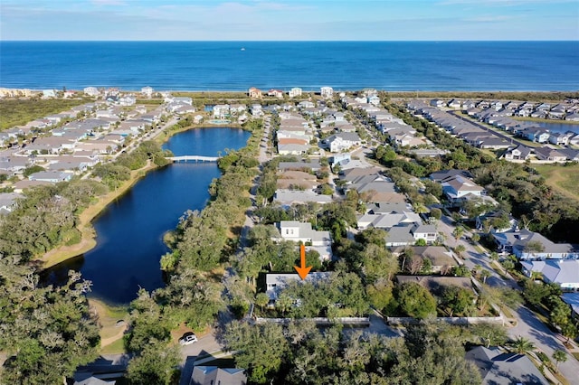 aerial view featuring a water view and a residential view