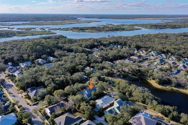 bird's eye view featuring a residential view, a water view, and a forest view