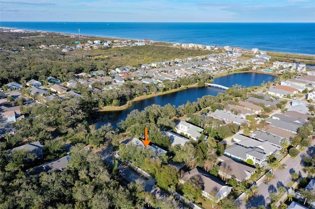 birds eye view of property with a water view and a residential view