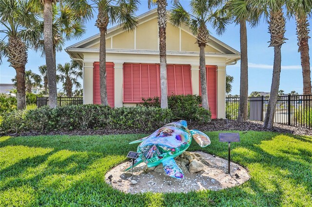 35 Smiling Fish Ln, Palm Coast, FL 32137 - view of property exterior with stucco siding