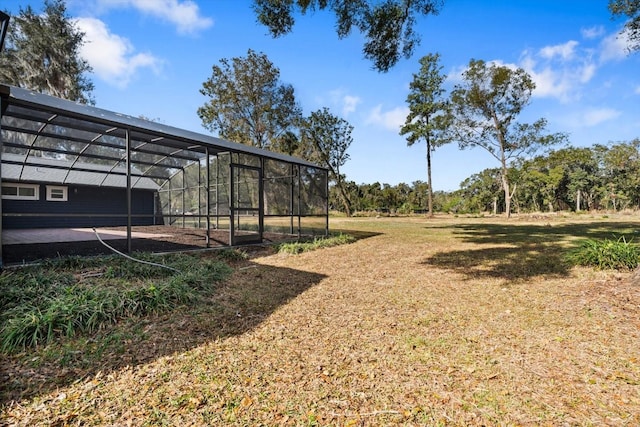 view of yard with a lanai