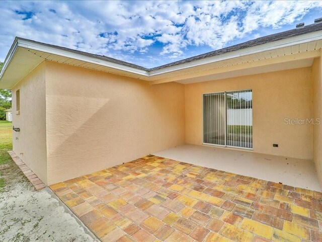 back of house with a patio