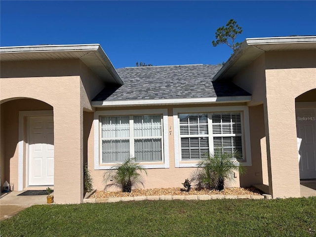 view of property exterior featuring a lawn