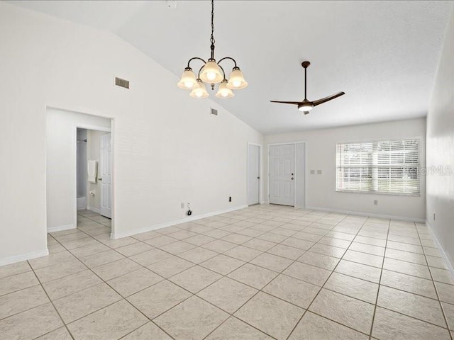 tiled spare room featuring ceiling fan with notable chandelier and high vaulted ceiling