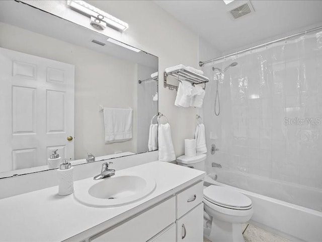 full bathroom with tile patterned flooring, vanity, toilet, and shower / bath combo with shower curtain