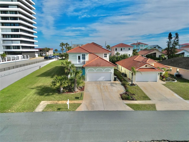 view of front facade featuring a front yard and a garage