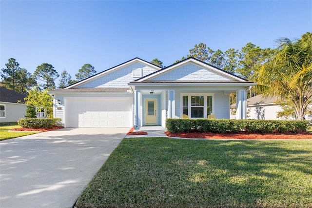 view of front of property featuring driveway, an attached garage, and a front lawn