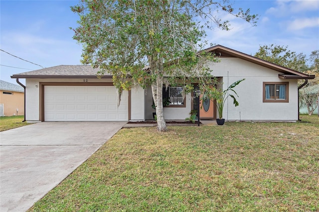 view of front of property featuring a garage and a front lawn