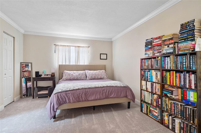 carpeted bedroom with a textured ceiling and ornamental molding