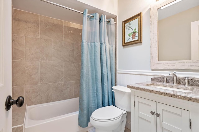 full bathroom featuring shower / tub combo, vanity, and toilet