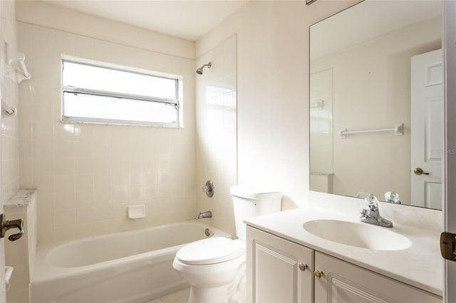 full bathroom featuring vanity, toilet, and tiled shower / bath