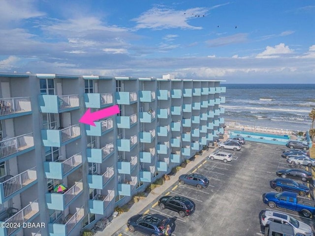 313 S Atlantic Ave Unit 5230, Daytona Beach, FL 32118 - view of apartment building / complex featuring uncovered parking and a water view