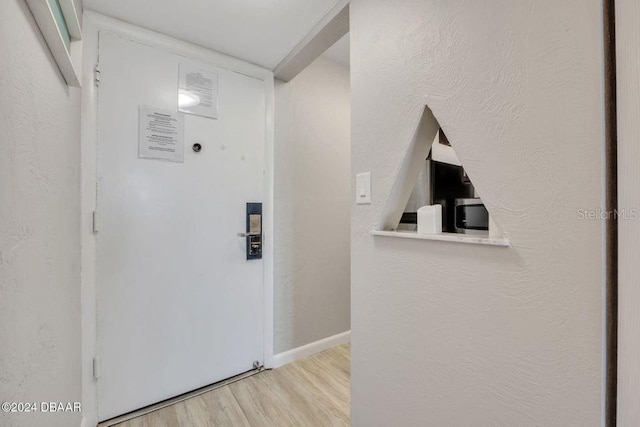 entryway with light hardwood / wood-style floors