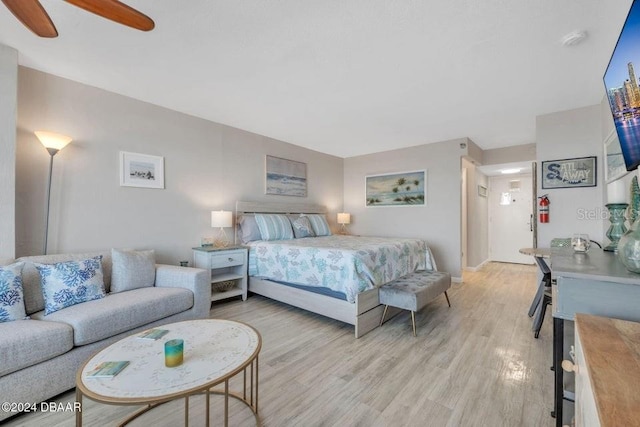 bedroom featuring light hardwood / wood-style floors and ceiling fan