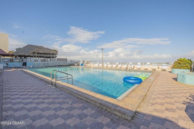 view of swimming pool with a gazebo and a patio