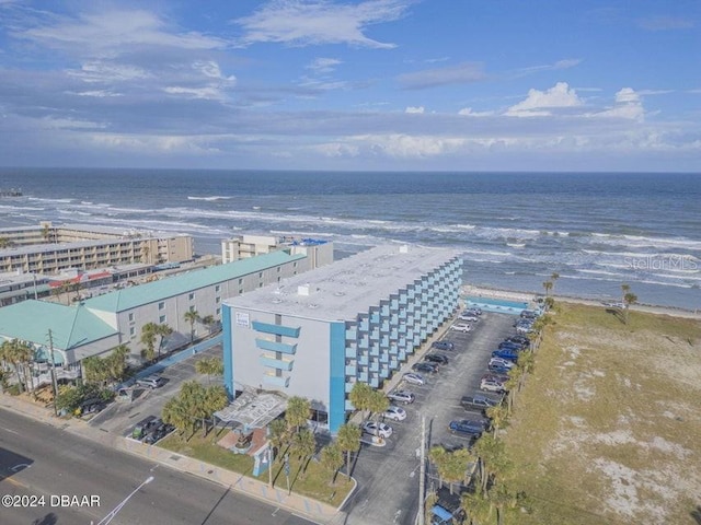 bird's eye view featuring a water view and a view of the beach