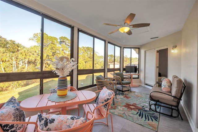 sunroom / solarium with ceiling fan