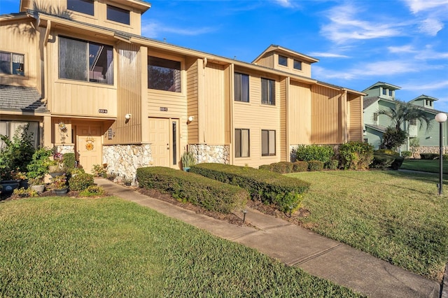 view of property with a front lawn