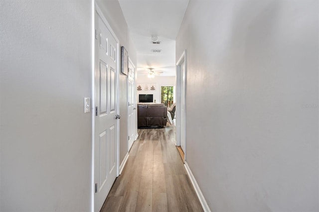 hallway featuring hardwood / wood-style flooring