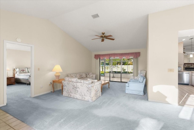 carpeted living room featuring ceiling fan and high vaulted ceiling